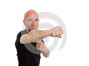 Man in teeshirt throwing a punch photo