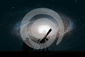 Man with telescope looking at the stars. Bode`s Galaxy, M81