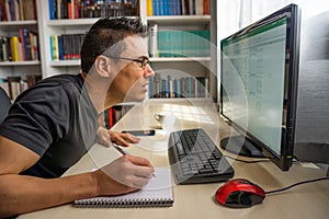 Man teleworking in front of the computer