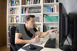 Man teleworking in front of the computer