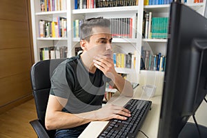 Man teleworking in front of the computer