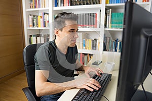 Man teleworking in front of the computer