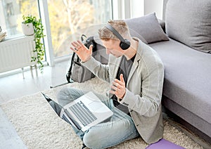Man teleworking using online communication