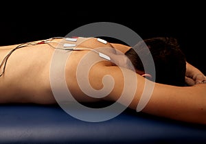 Man with TENS on his back