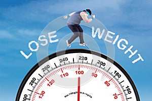 Man with text lose weight and scale photo