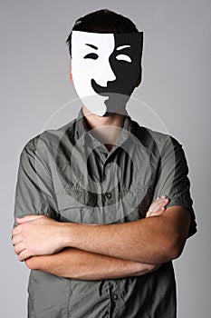 Man in theater smiling mask