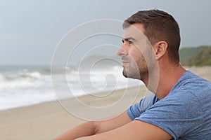 Man thinking at the beach with copy space
