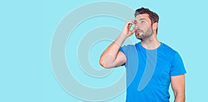 Man thinking with confuse face on isolated background. Hispanic Man thinking about question, pensive expression. Doubt think