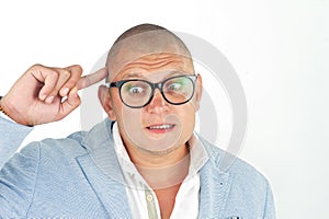 Man thinking while doing a silly face with nerd glasses isolated on white