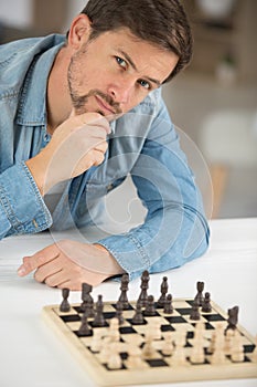 Man thinking how to play chess