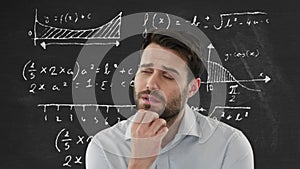 Man thinking over mathematical equations.