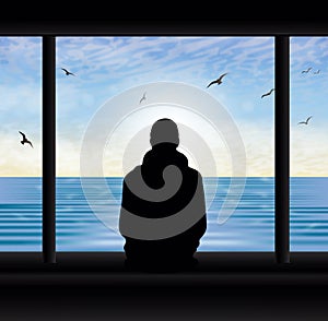 Man thinking silhouette at the window looking at lake