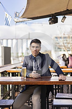 Man thinking something after checking his smartphone