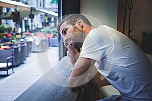 Man thinking by the window