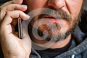 Man threating someone over the phone