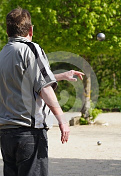Man throwing ball in petanque