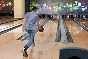 Man throwing bowling ball