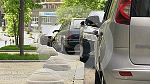 Man throwing garbage out of car window, environmental pollution, ecology in city