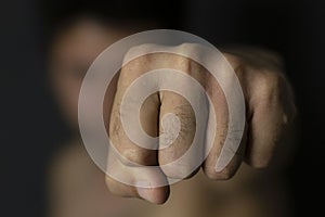 Man throwing punch with blurred background photo