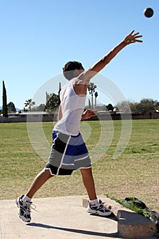 Man throwing shot put