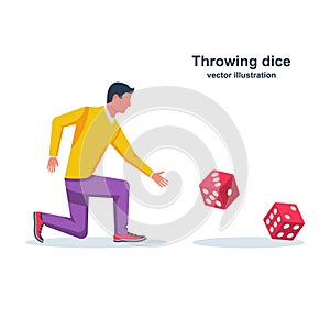 Man throws dice. Red dices on table. An avid person