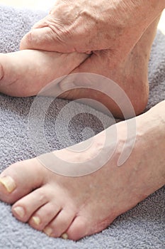 Man with thumb on his arch