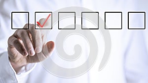 Man ticking a check box