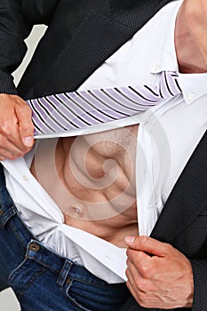 Man in tie rip clothes off torso showing abs.