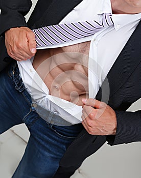 man in tie rip clothes off torso showing abs