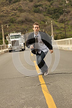 A Man In A Tie Sprinting