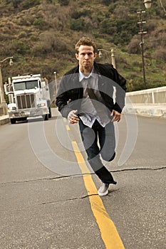 A Man In A Tie Sprinting
