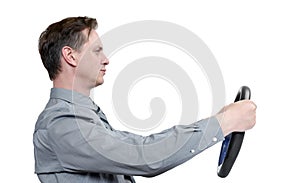 Man in tie with a steering wheel, side view, isolated on white background. Car drive concept