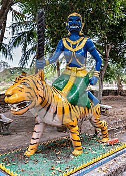 Man on tiger statue at Wang Saen Suk monastery, Bang Saen, Thailand