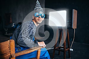 Man in tinfoil helmet and hypnotizing glasses, UFO