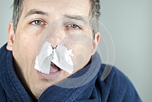 Man With Tissue In Nose