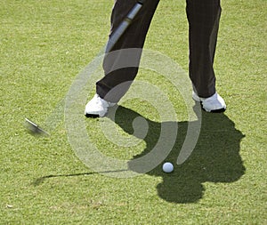 Man about to hit golf ball