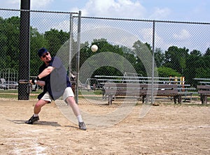 Man about to hit a softball