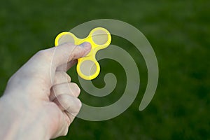 Man to play with Fidget Spinner i