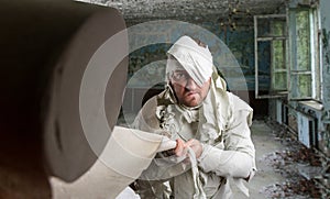 Man in toilet paper in neglected room