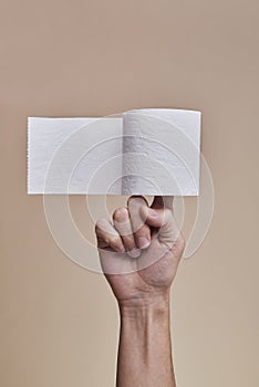Man with a toilet paper roll in his hand