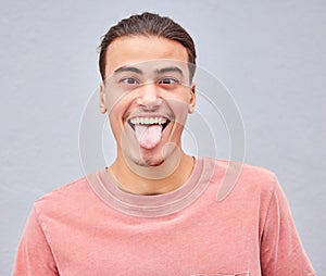 Man, tongue or funny face on isolated background in silly, goofy or comedy on grey mockup, wall or mock up backdrop