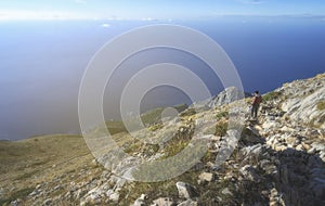 A man on the top of the Agion Oros Athos Mountain in Greece