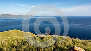 A Man on the Top of Gili Lawa Darat Island photo