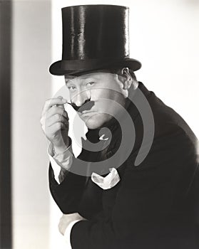 Man in top hat with waxed mustache