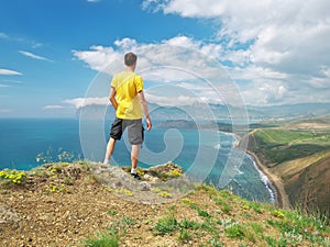 Man on top of mountain.