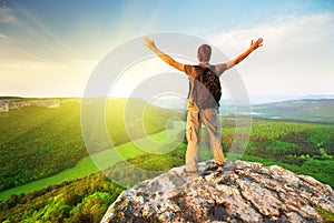 Man on top of mountain