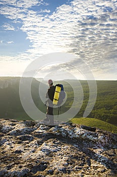 Man on top of mountain.