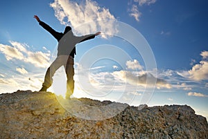 Man on top of mountain.