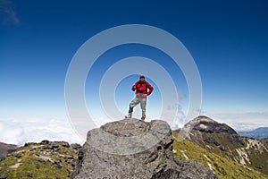 Man on top of mountain