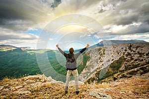 Man on top of mountain.